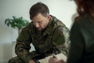 veteran sitting and talking to his therapist