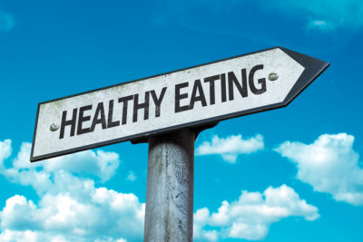 healthy Eating sign with sky background